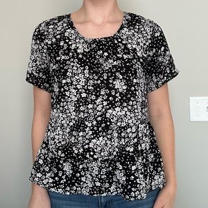 Black and white womens peplum blouse. Size medium.